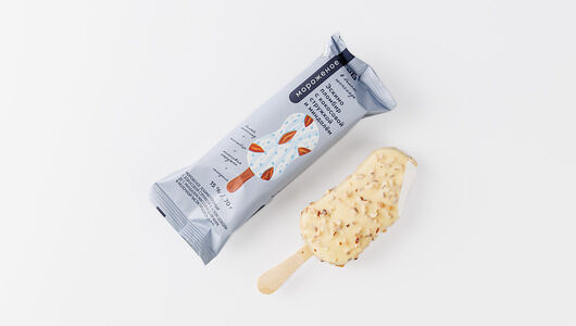 Эскимо пломбир с кокосовой стружкой и миндалем в бел. шок.(Продукт замороженный)