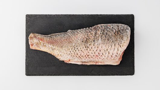 Тушка карпа разделанная без головы замороженная