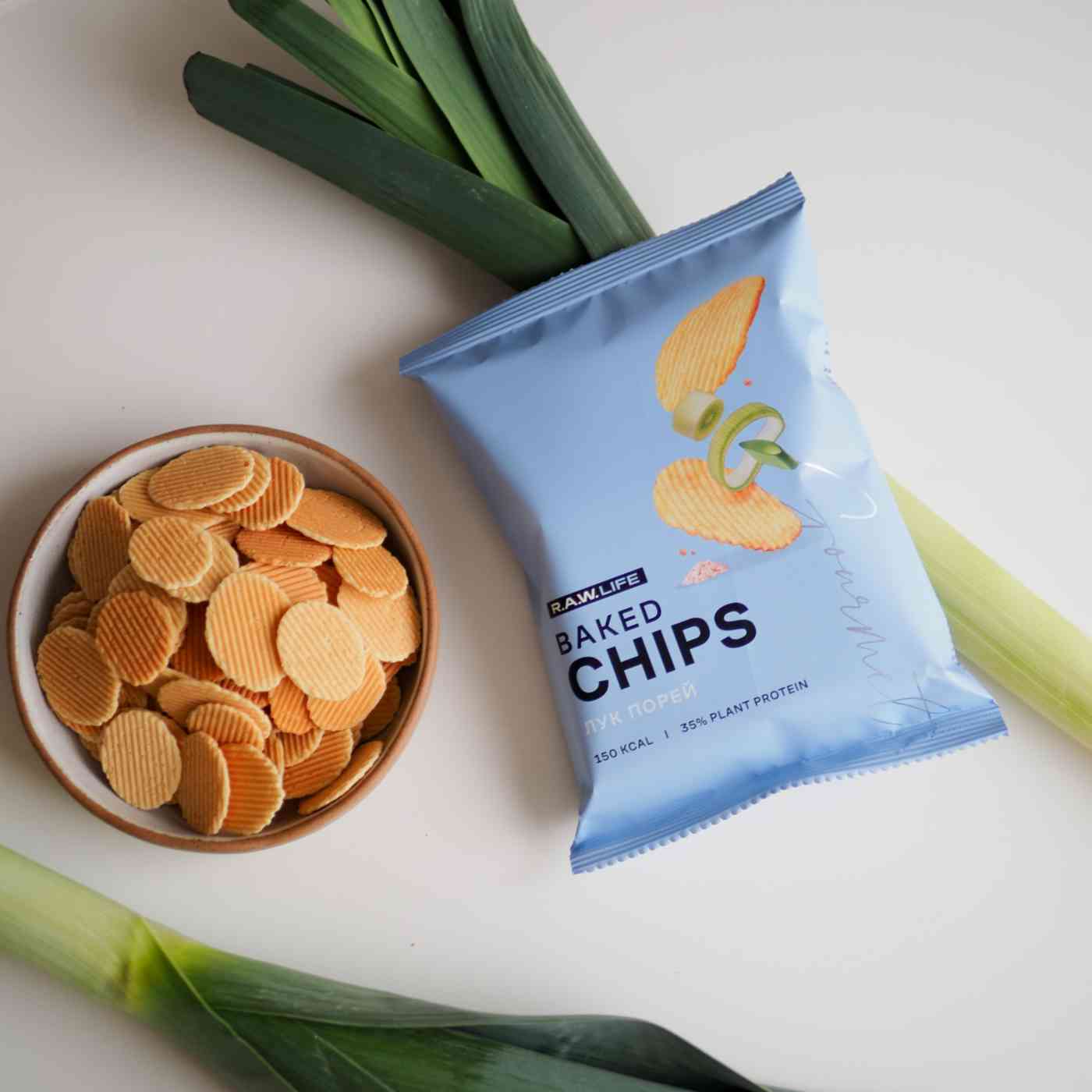 

Чипсы протеиновые R.A.W.Life Baked Chips лук порей 35 г