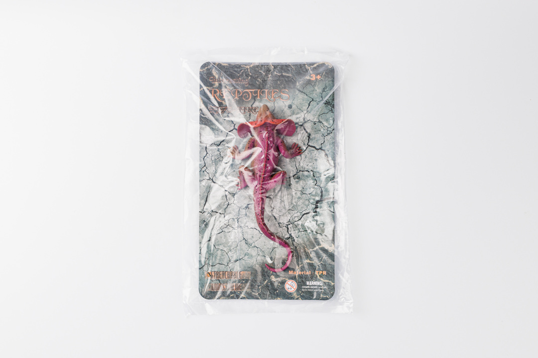 

Игрушка ящерица красная