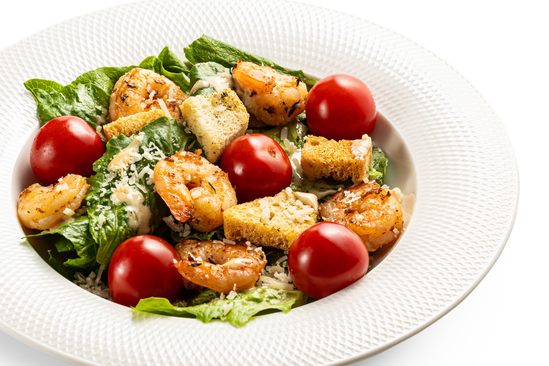 

Салат Цезарь с тигровыми креветками и гренками из багета