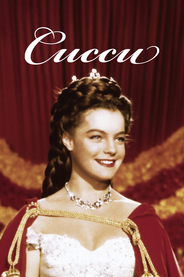 Әйелі тамақ әзірлеп жатыр, ал күйеуі қызын сиқытып жатыр.