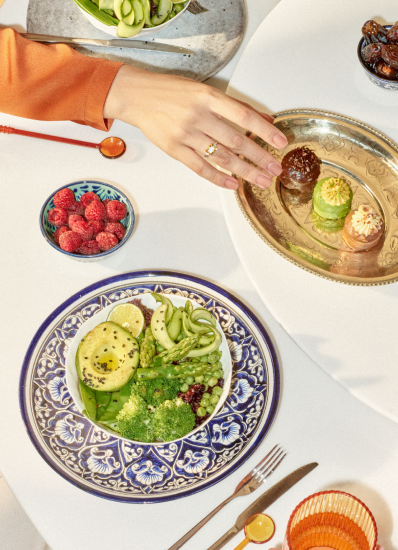 A dining table set with various dishes and cutlery