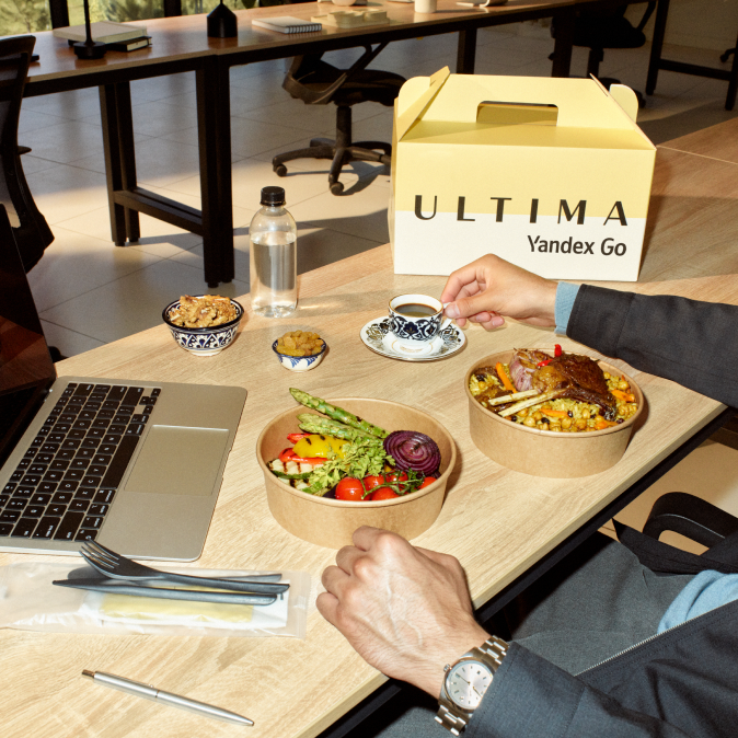 A customer receiving a food delivery at their office