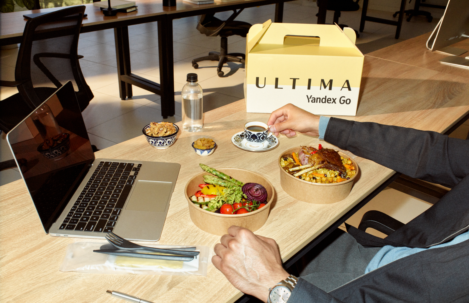 A customer receiving a food delivery at their office