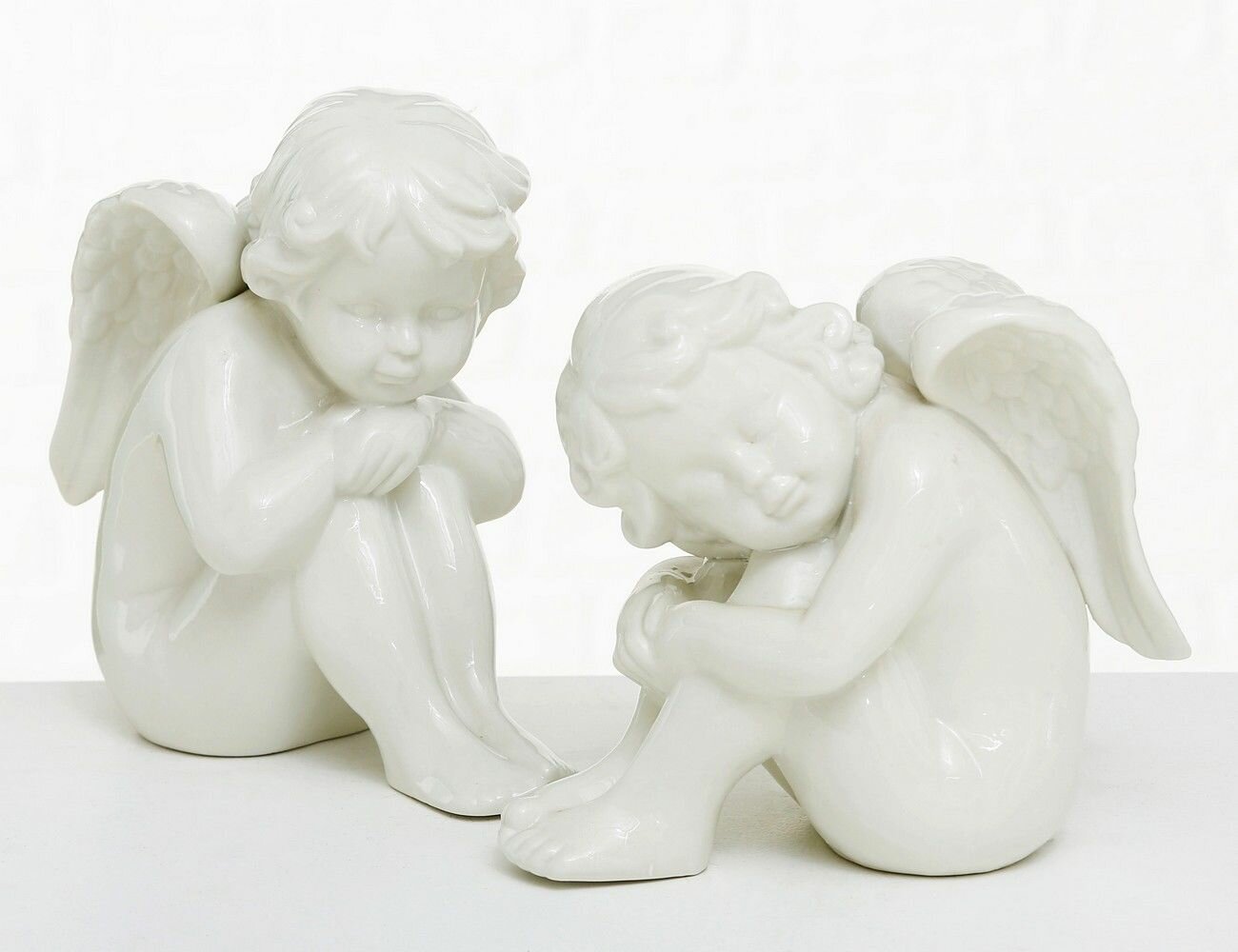 Набор декоративных фигурок сидящий малыш-ангел фарфор белые 16 см 2 шт. Boltze 1827600-набор