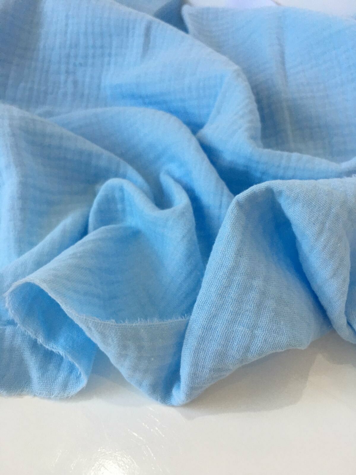 0.5м. муслин двухслойный жатый. Хлопок 100%, ширина 140 см. Цвет голубой, ткань для шитья и рукоделия