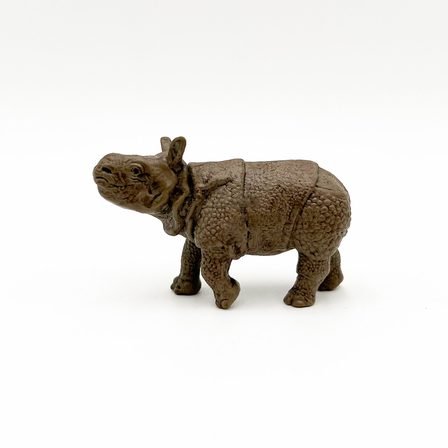 Фигурка Детеныш индийского носорога (идет)