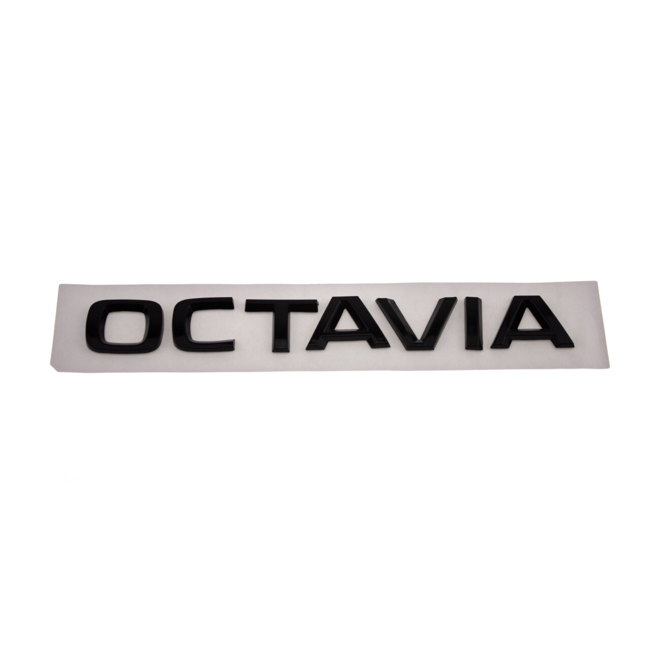 Шильдик на багажник Octavia черный глянец