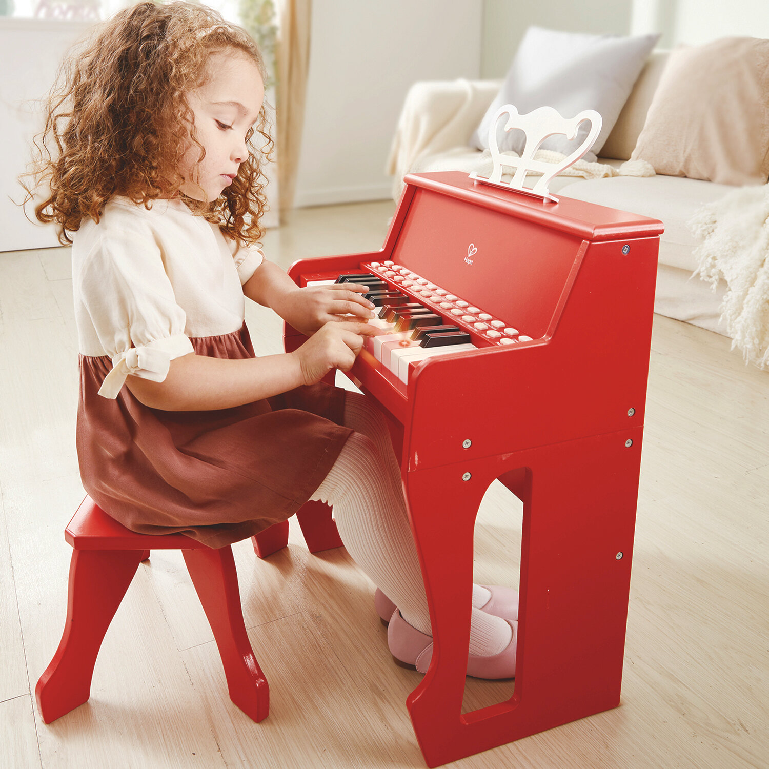 Музыкальная игрушка Hape Пианино с табуреткой, цв. Красный E0630_HP