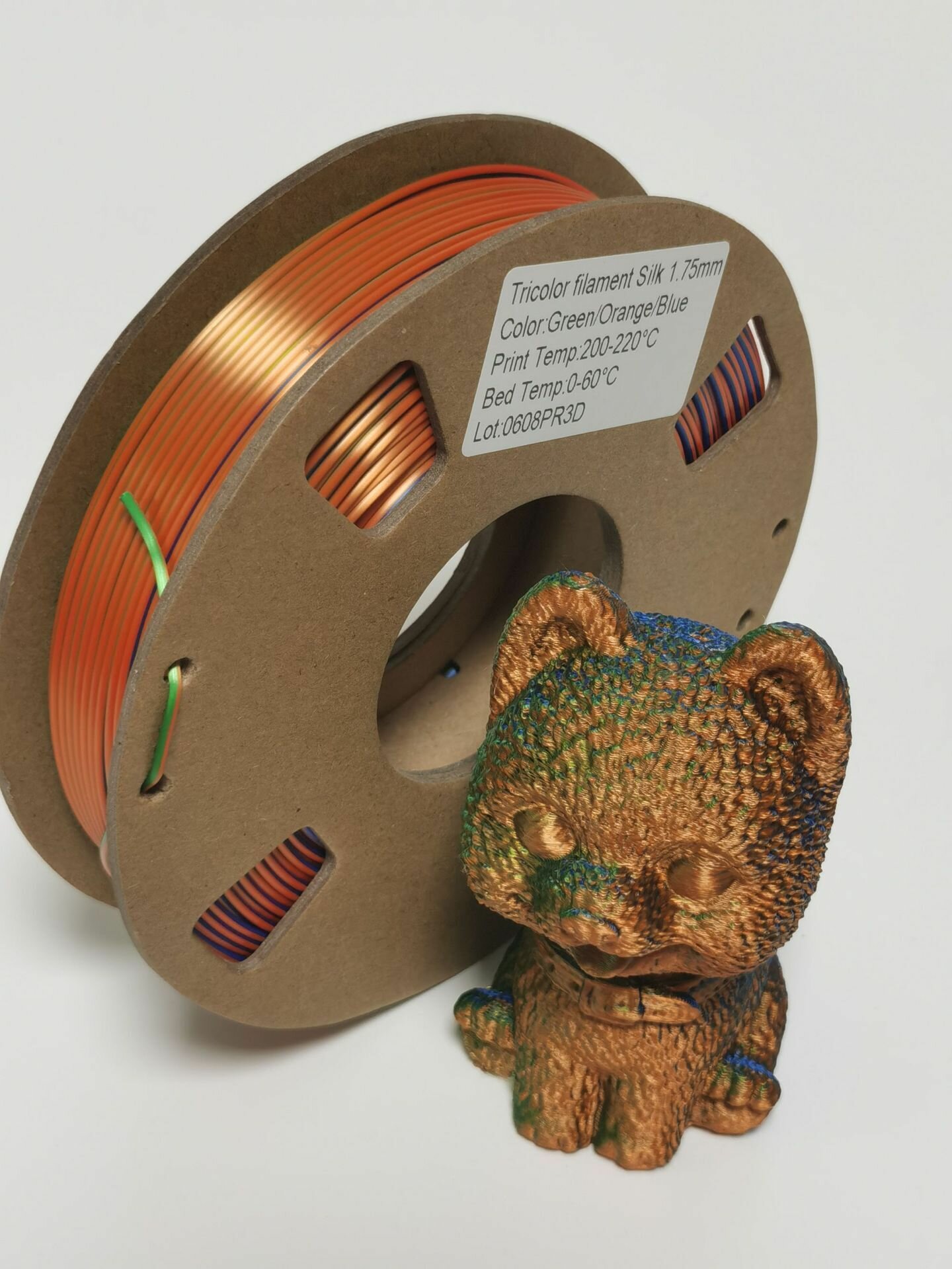 PLA Трехцветный (Silk Шелковый) пластик PinRui Оранжевый-синий-зеленый 1.75 мм 1 кг