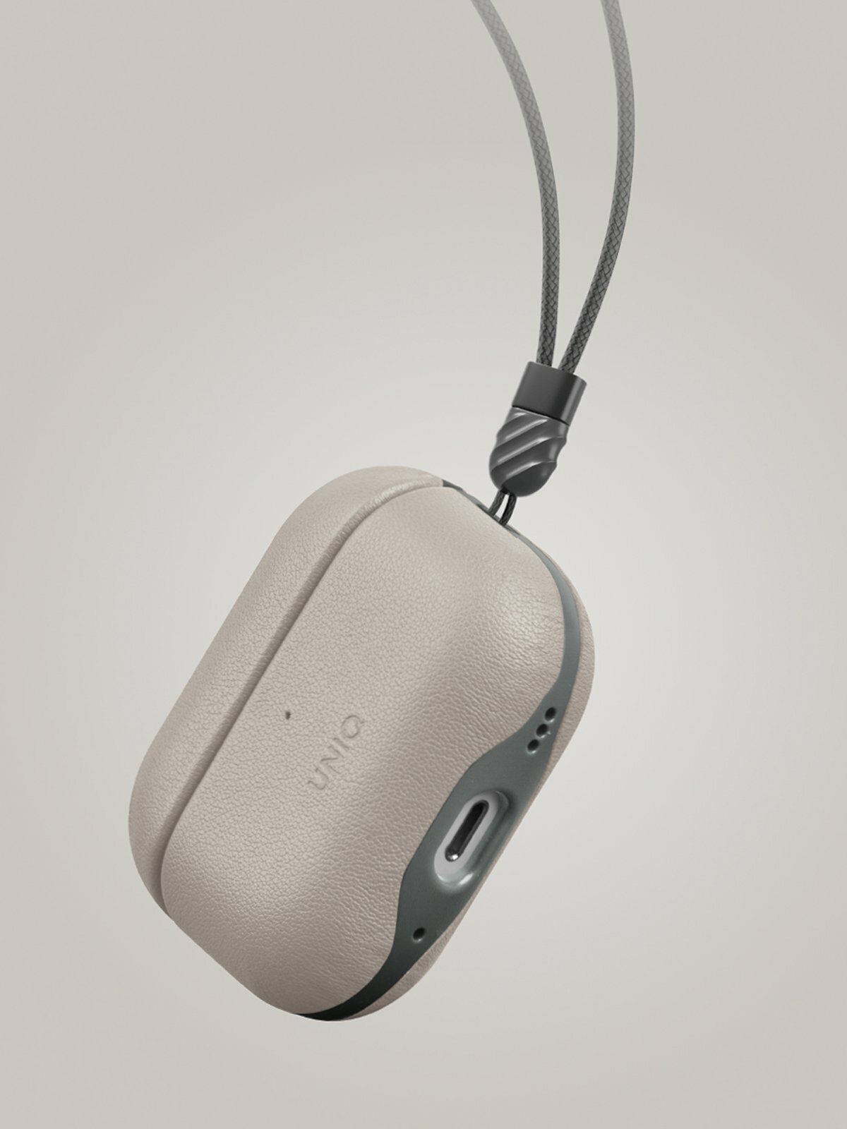 Чехол из искусственной кожи Uniq Lyden DS для AirPods Pro 2, слоновая кость/зеленый мох (IVORY/LICHEN GREEN) — фото 1