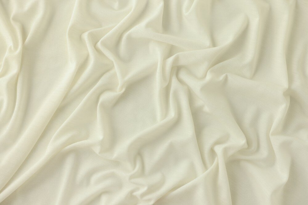 Ткань трикотаж смесовый молочного цвета