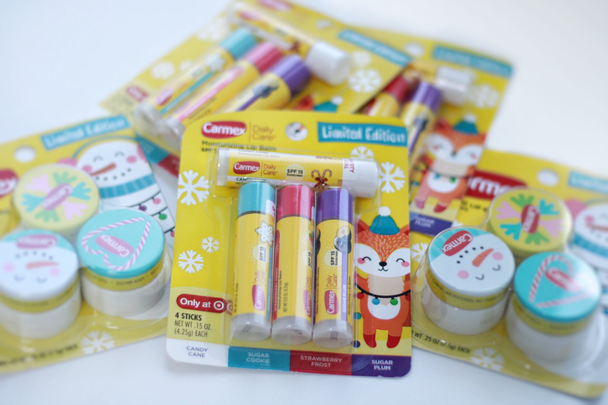 Carmex Limited Edition Набор бальзамов для губ Стик 4 шт (ягодный, печенье, леденец, слива) — фото 1