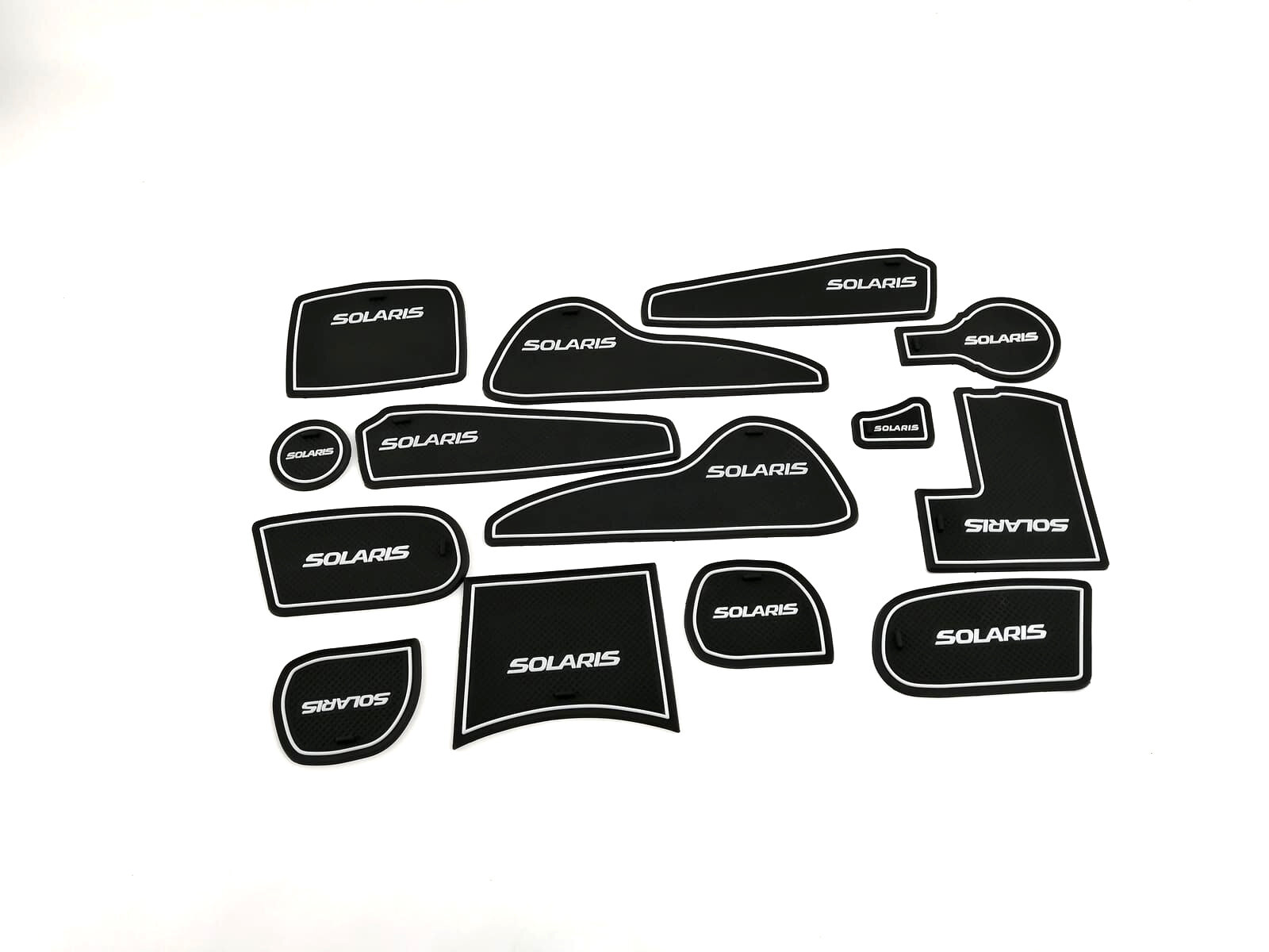 фото Коврики силиконовые в ниши автомобиля Hyundai Solaris 2011-2014 г. в. с белым текстом