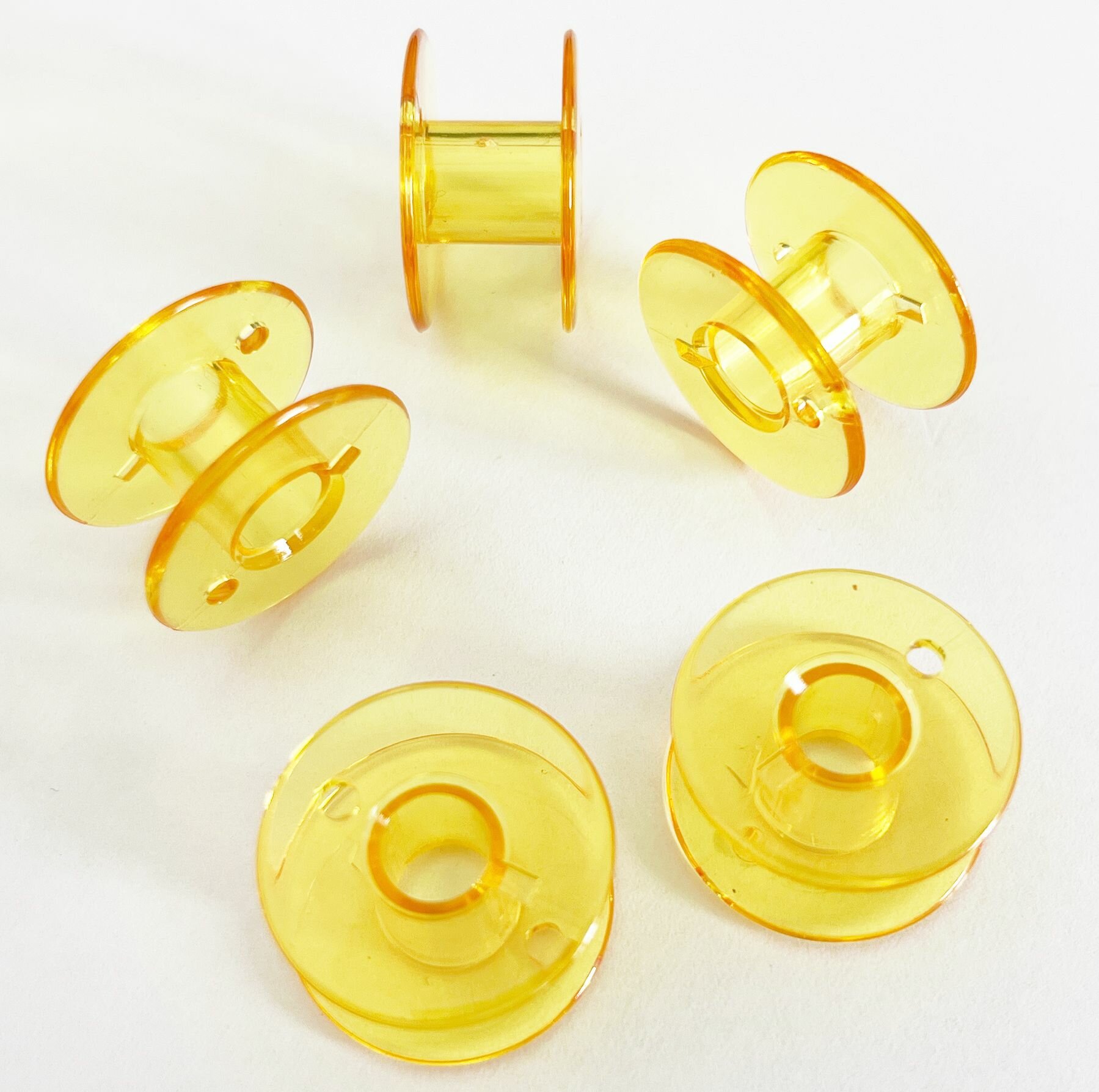 Комплект желтых шпуль (10 шт) для бытовых швейных машин JANOME, BROTHER, JUKI, BERNETTE.