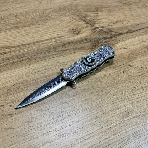 Складной нож спиннер