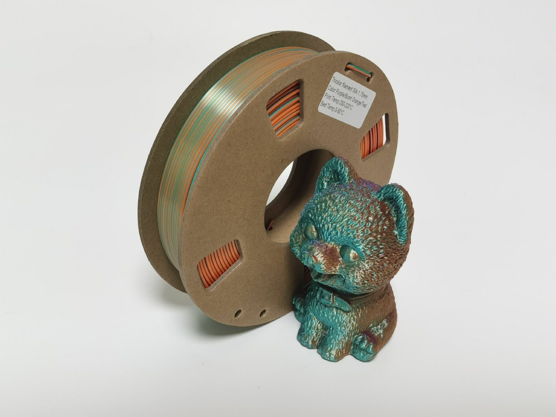 PLA Трехцветный (Silk Шелковый) пластик PinRui Фиолетовый-жжённый апельсин-бирюзовый 1.75 мм 1 кг