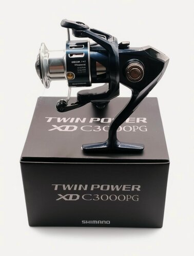 Изображение товара Катушка Shimano Twin Power XD С3000PG для спиннинга надежная, мощная, плавный ход.