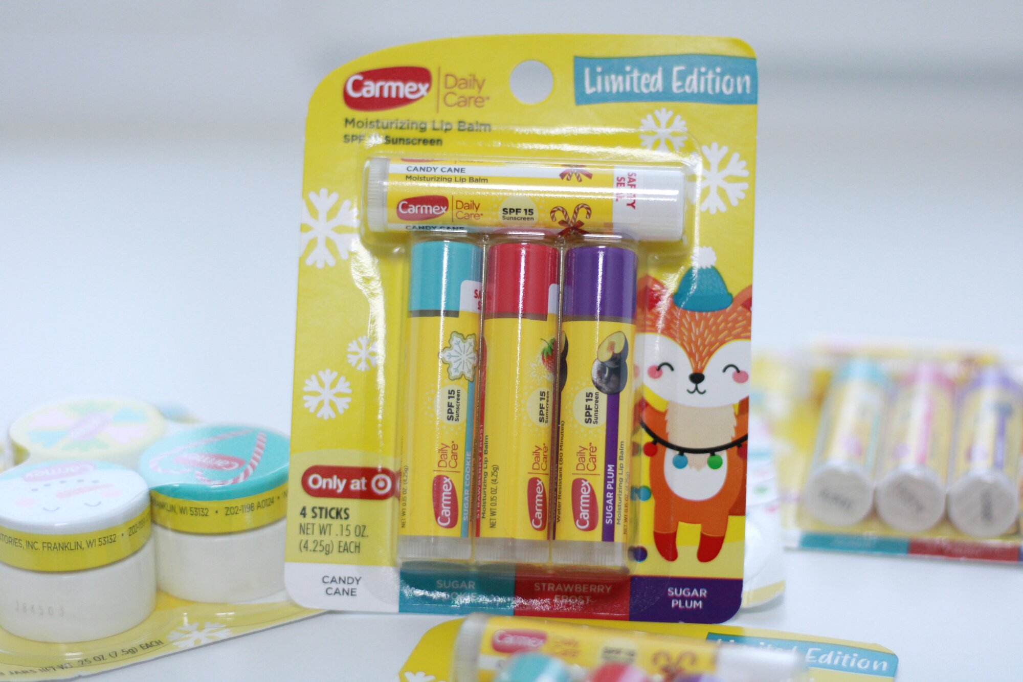 Carmex Limited Edition Набор бальзамов для губ Стик 4 шт (ягодный, печенье, леденец, слива) — фото 1