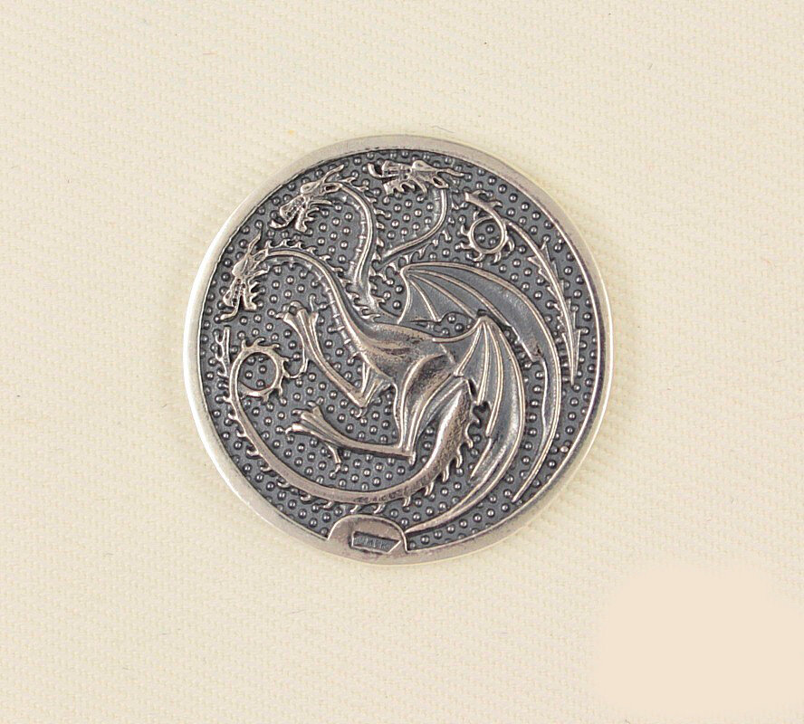 Серебряная монета с драконом "Триксель"