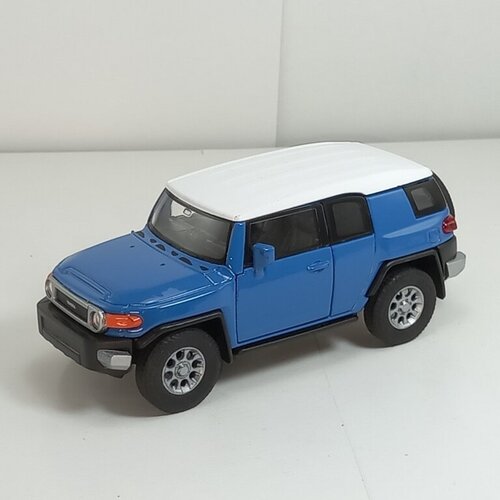 машина welly 1 34 39 toyota fj cruiser big wheel синий 47003 Металлическая машинка 1:34-1:39 TOYOTA FJ CRUISER, синий 43639L-D Welly