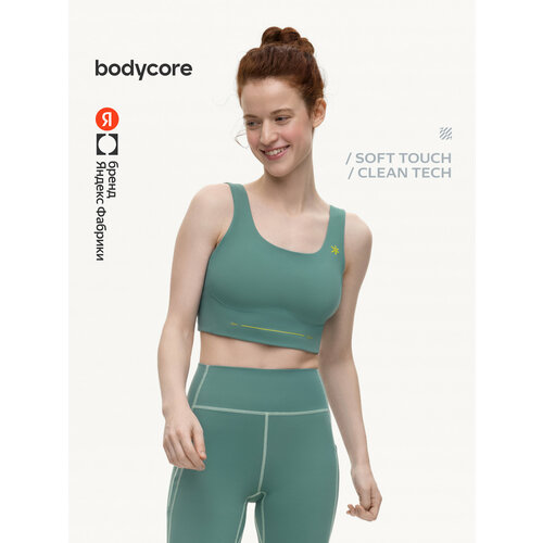 фото Топ спортивный bodycore из ткани soft touch с антибактериальной пропиткой, размер s, изумрудный