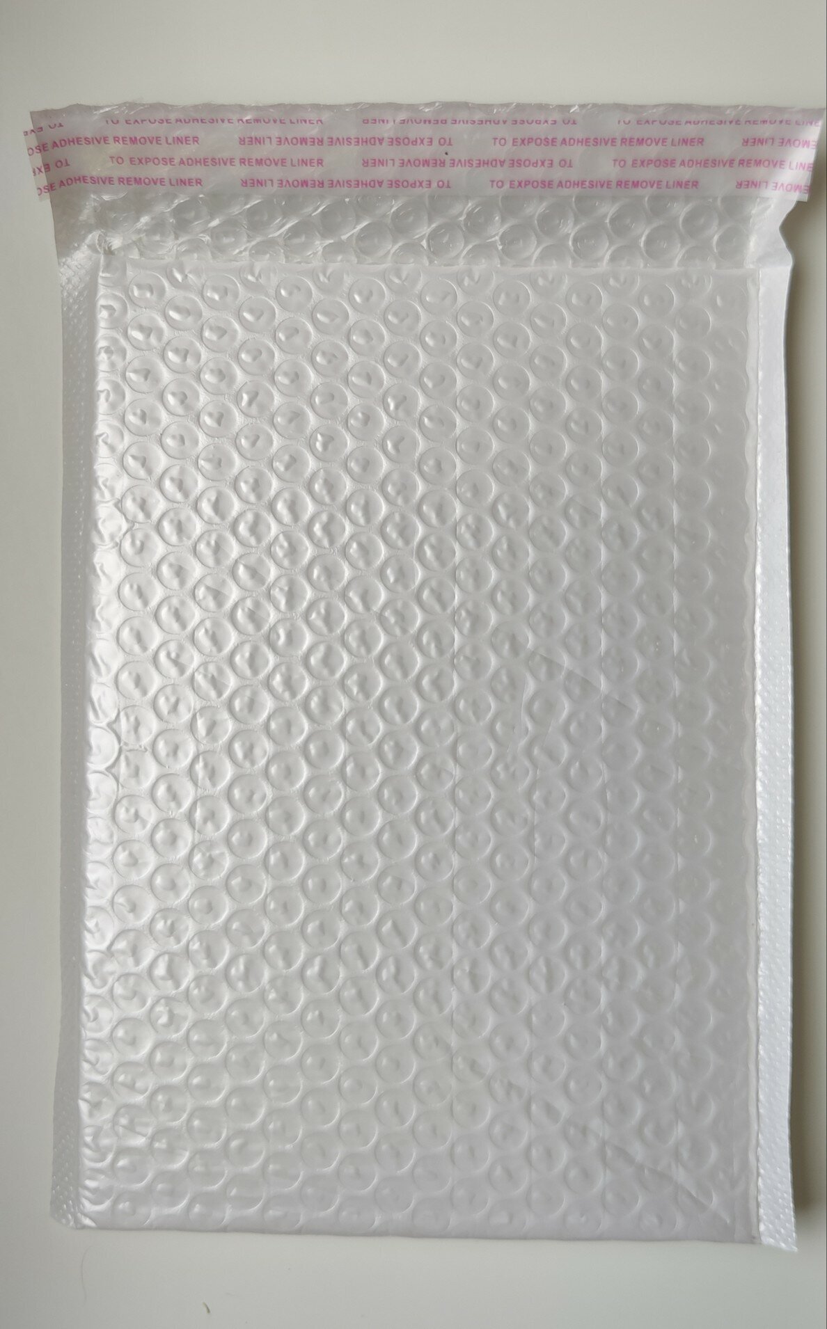 Пакет упаковочный воздушно-пузырьковый (пупырчатый) с клеевым краем, размер 18*23см + 4см, белый, непрозрачный, 10 шт - фотография № 1