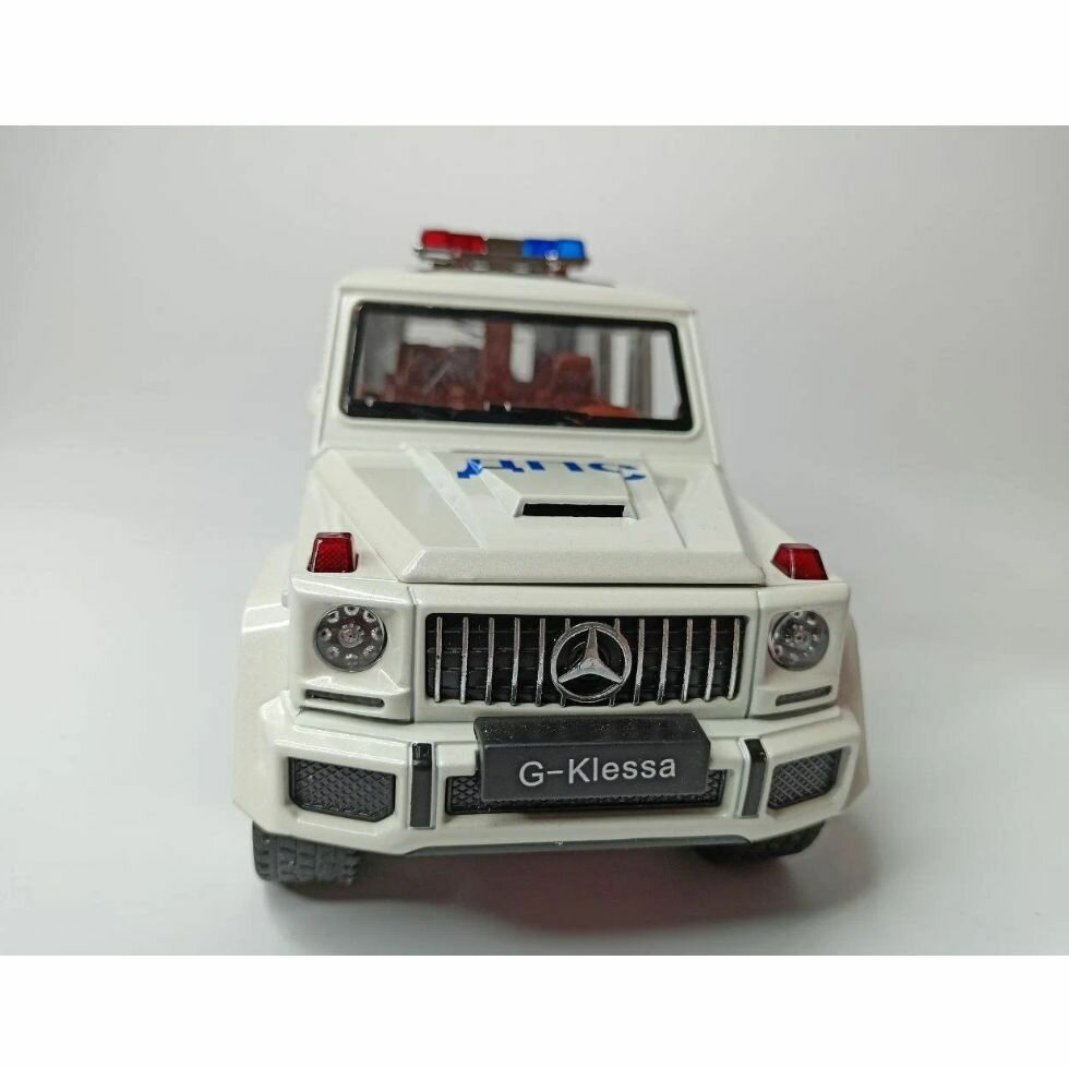 Машинка Mercedes-Benz G-класса G63 AMG Мерседес Бенц Гелик ДПС полиция (1:24) 22 см металл, инерция, открываются двери, капот и багажник, свет и звук