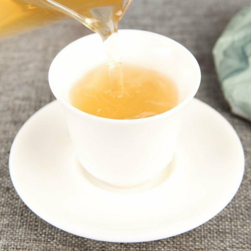 Настоящий китайский зеленый Чай Шен Пуэр У Лян Сан 2020г., блин 100 гр., прессованный зеленый чай ПуЭр - фотография № 3