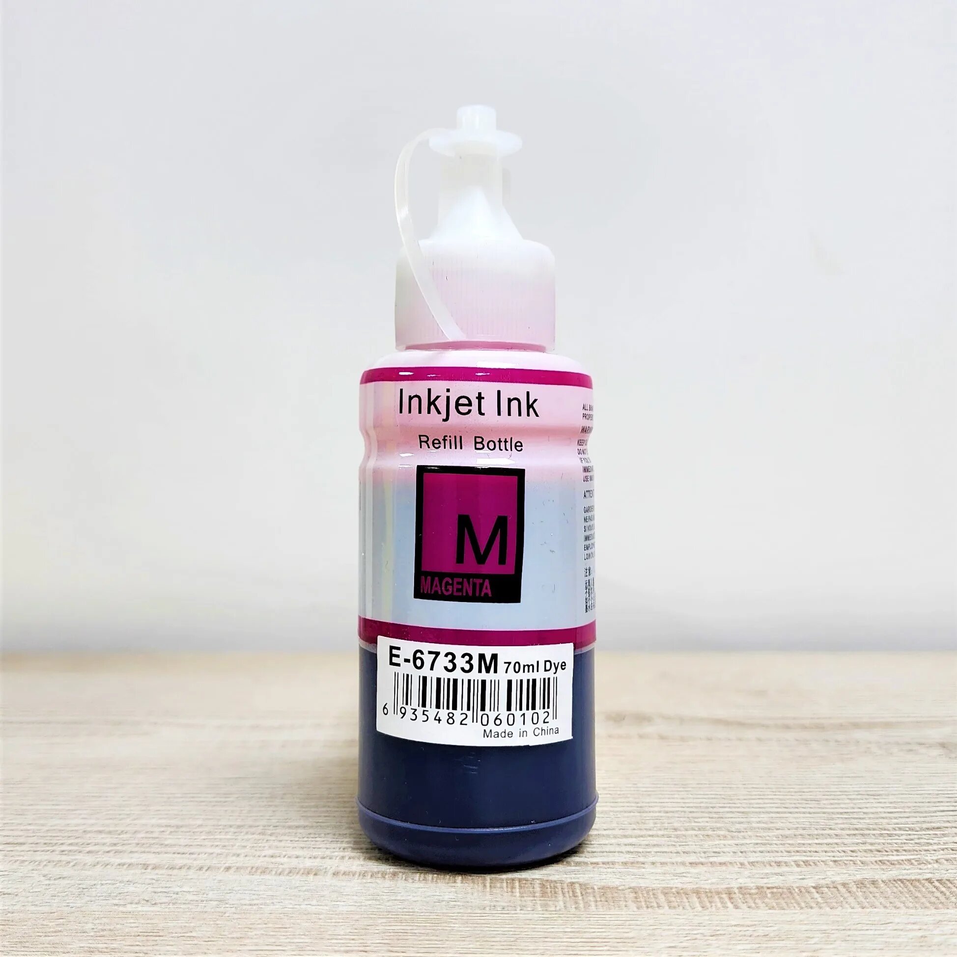 Epson E‑673 (M) Magenta (пурпурный) чернила 70 мл (в бутылке). Совместимы с принтерами Epson серий EcoTank: L800, L805, L810, L850, L1800 и другими.