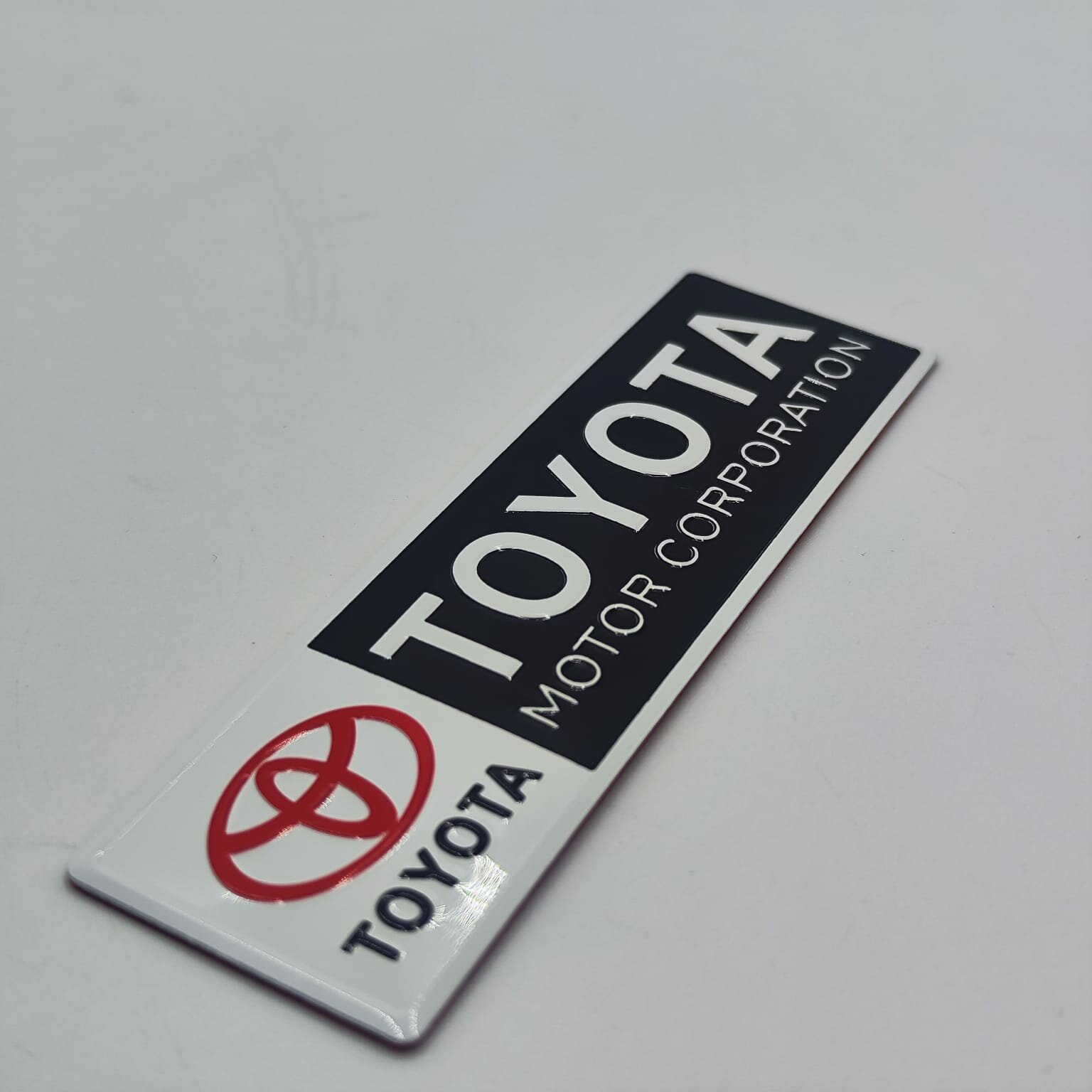 Шильдик надпись наклейка Toyota Motor Corporation 12см