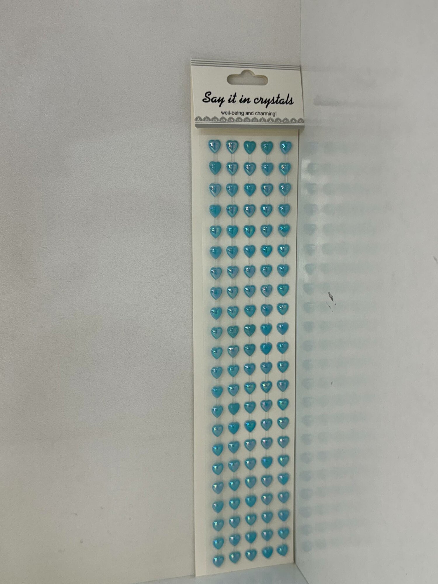 Это самоклеящиеся стразы в форме сердечек бренда Prima Marketing под названием "Say It in Crystals" голубые