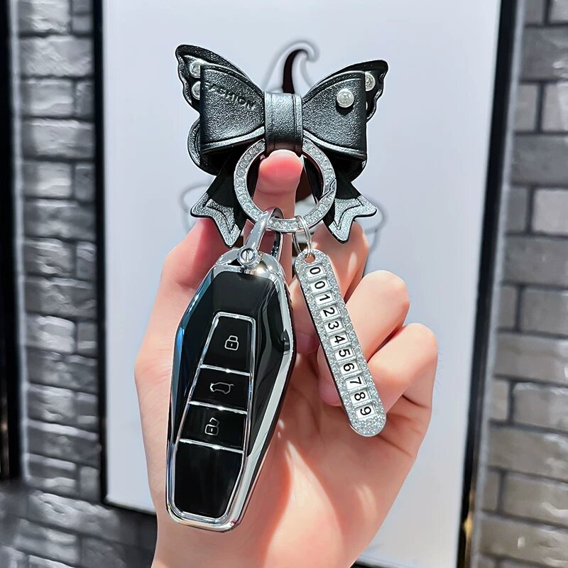Чехол для ключей Chery iCAR03 2024 с черной оболочкой, бабочкой-замком и серебряной биркой