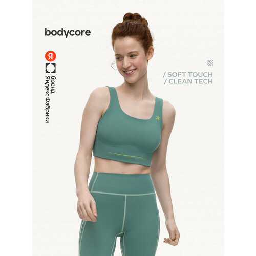 фото Топ спортивный bodycore из ткани soft touch с антибактериальной пропиткой, размер l, изумрудный