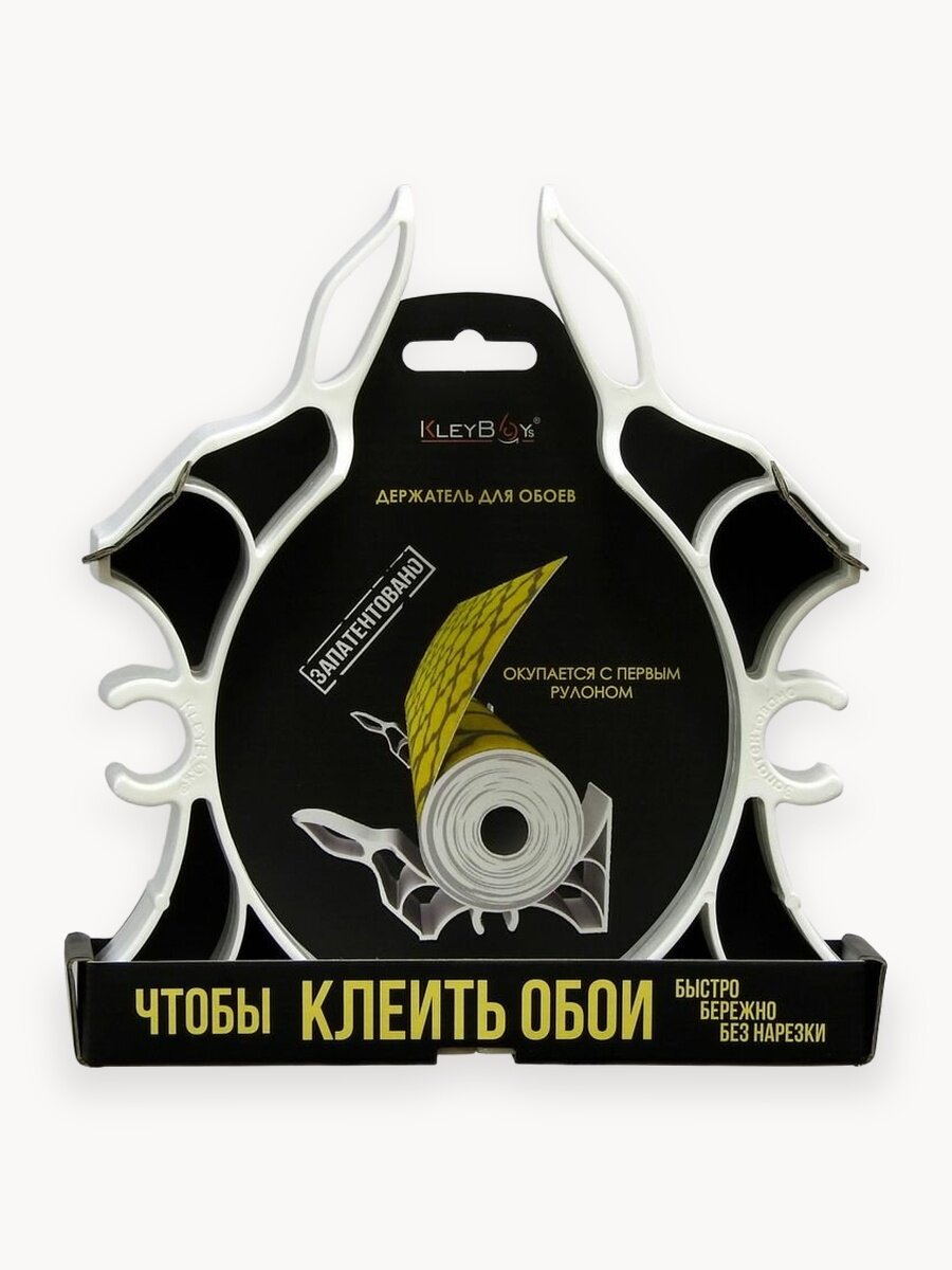 Держатель для поклейки обоев без нарезки на полу.