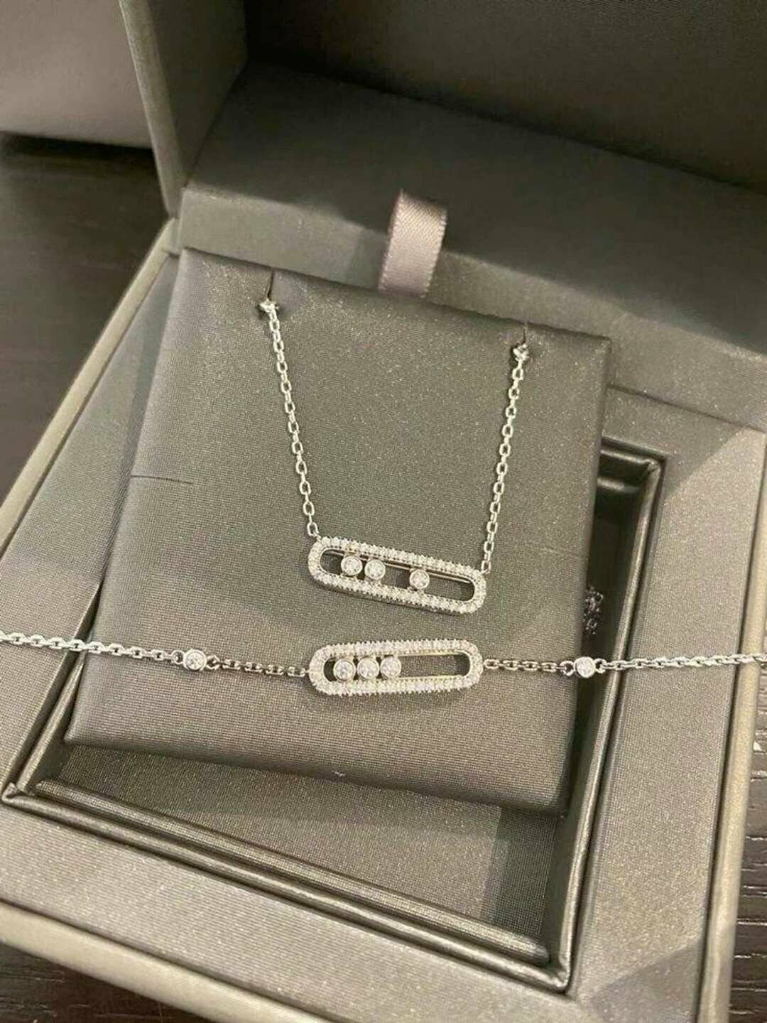 Комплект бижутерии: подвеска, кольцо, серьги, браслет