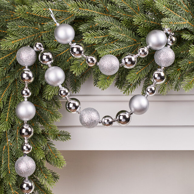 Гирлянда - бусы из шаров Новогодний Блеск 3-5 см 128*5 см серебряные Kaemingk 515270