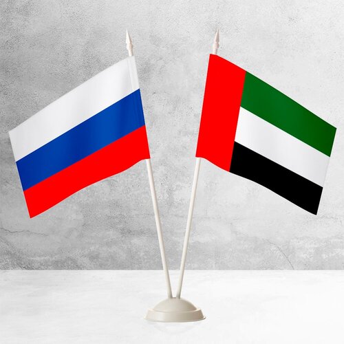 Настольные флаги России и ОАЭ на пластиковой белой подставке настольные флаги россии и георгиевский на пластиковой белой подставке