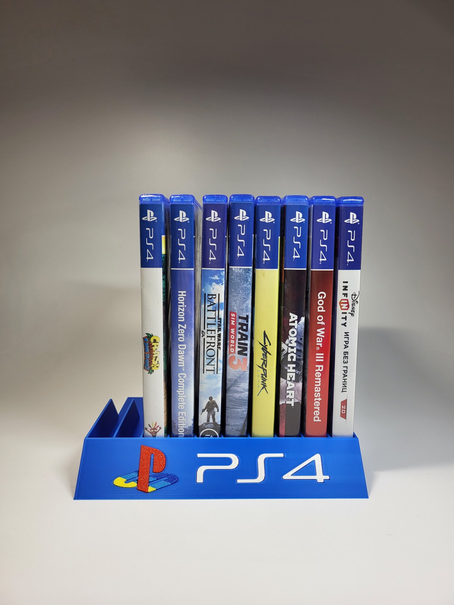 Подставка для игр Sony Playstation 4/ PS4 синяя с цветным логотипом, на 10 дисков