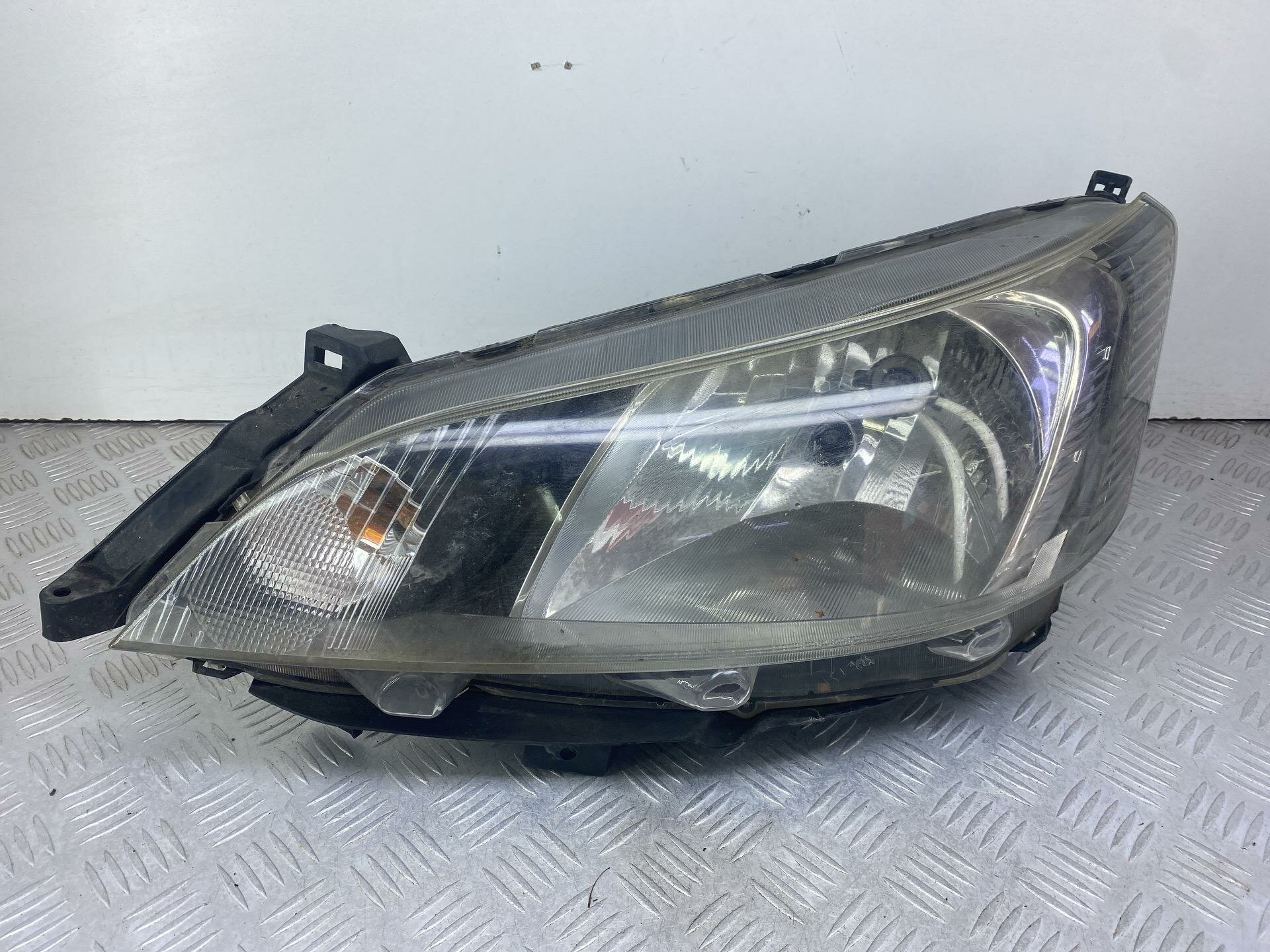 Фара левая Nissan NV200 1 (2009 - 2026) X11MHLLH