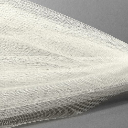 Фатин Кристалл средней жесткости блестящий арт. K. TRM шир.300см, 100% полиэстер цв. 03 К уп.50м - св. молочный
