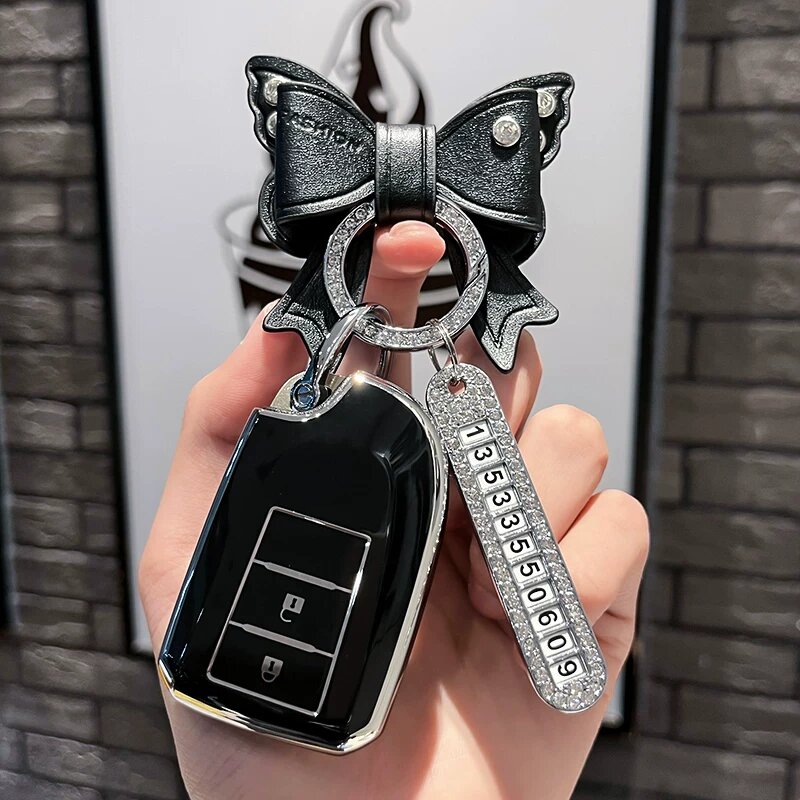Чехол для ключей Toyota Yaris Smart 2-кнопочный, черный, с серебряной табличкой и брелоком-бант