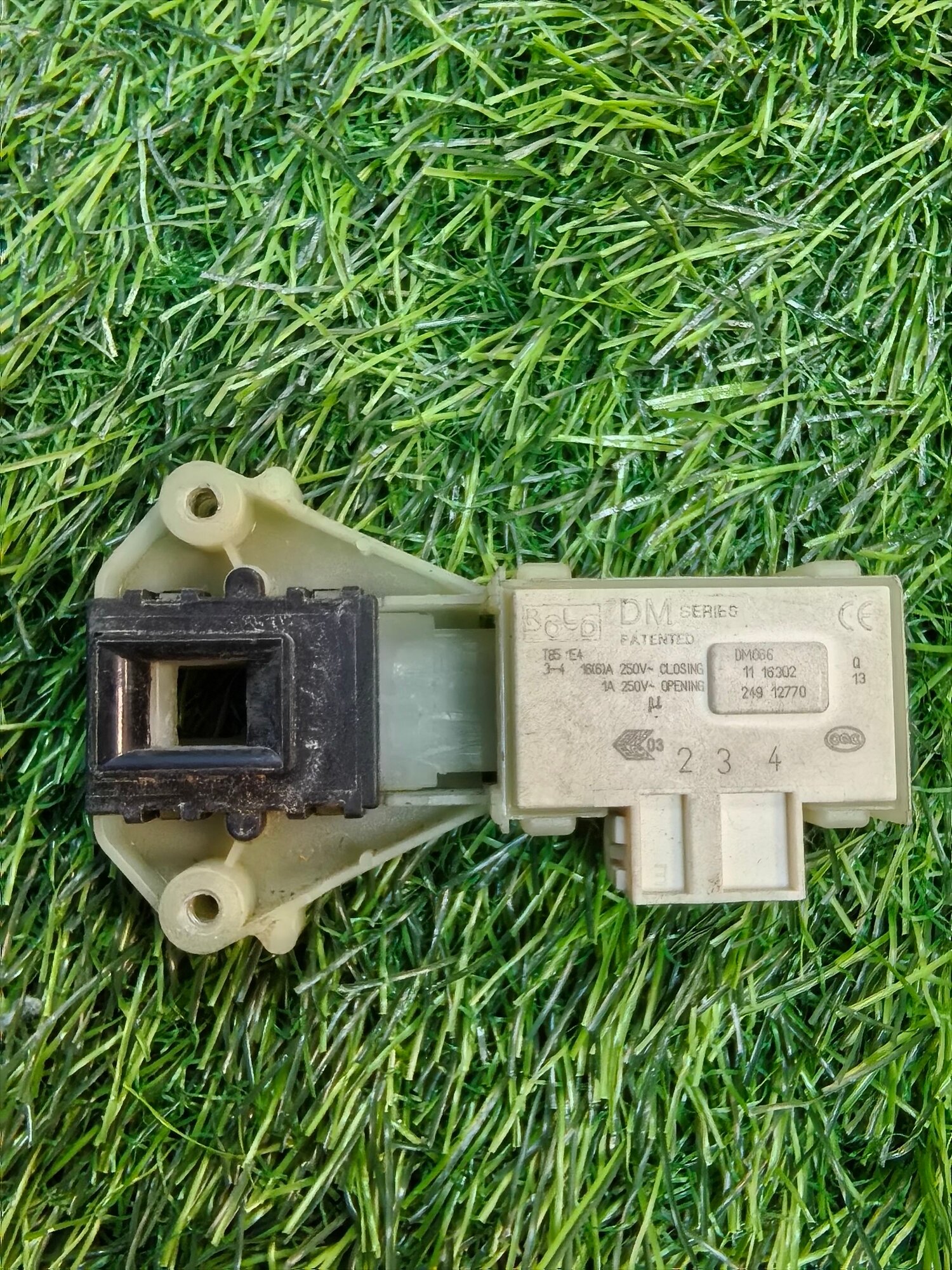 Замок(УБЛ) двери стиральной машины Rold DM066 066042 Indesit / Ariston / Hotpoint. Товар уцененный