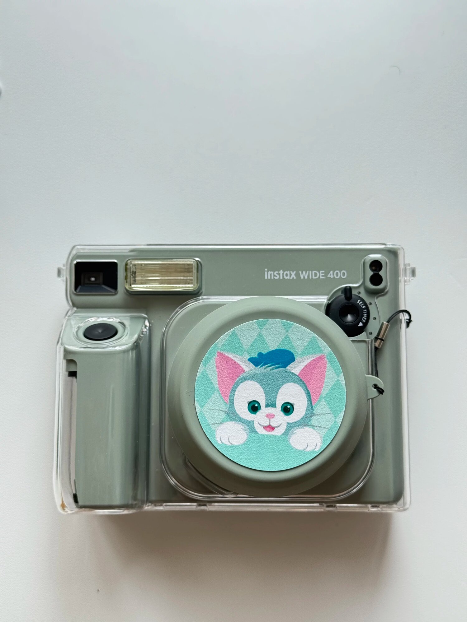 Силиконовый объективный колпачок с прозрачным чехлом для Instax Wide400 зеленого цвета с кожаной наклейкой Джеладони