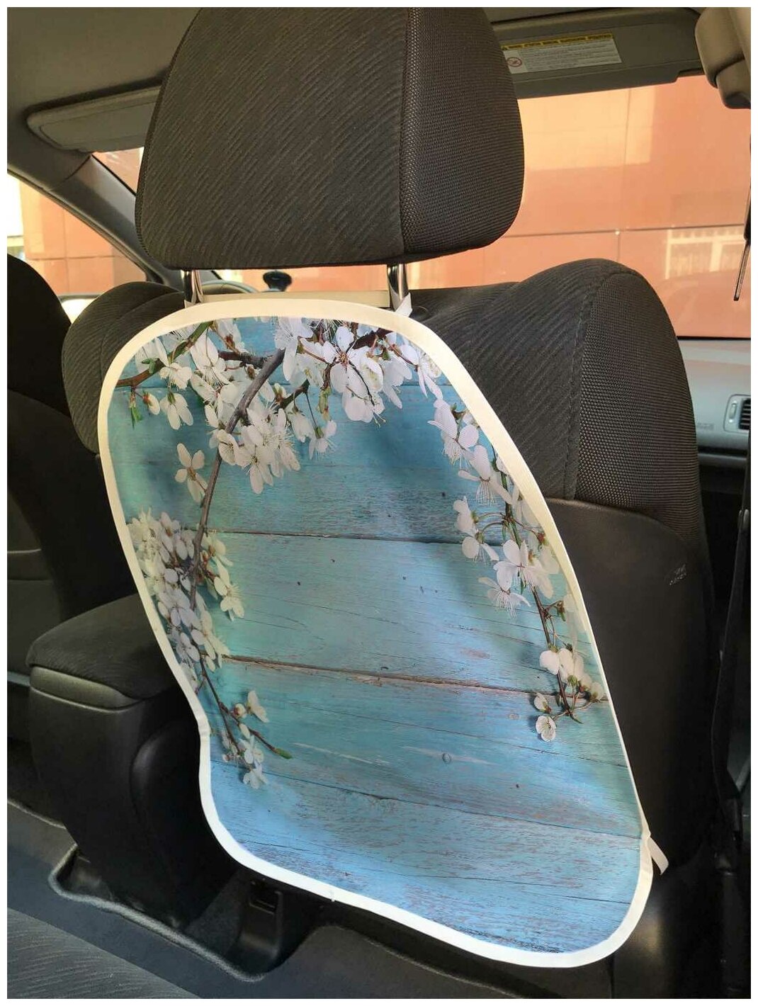 Защитная накидка JoyArty "Ветка вишни на деревянных досках" на спинку автомобильного сидения