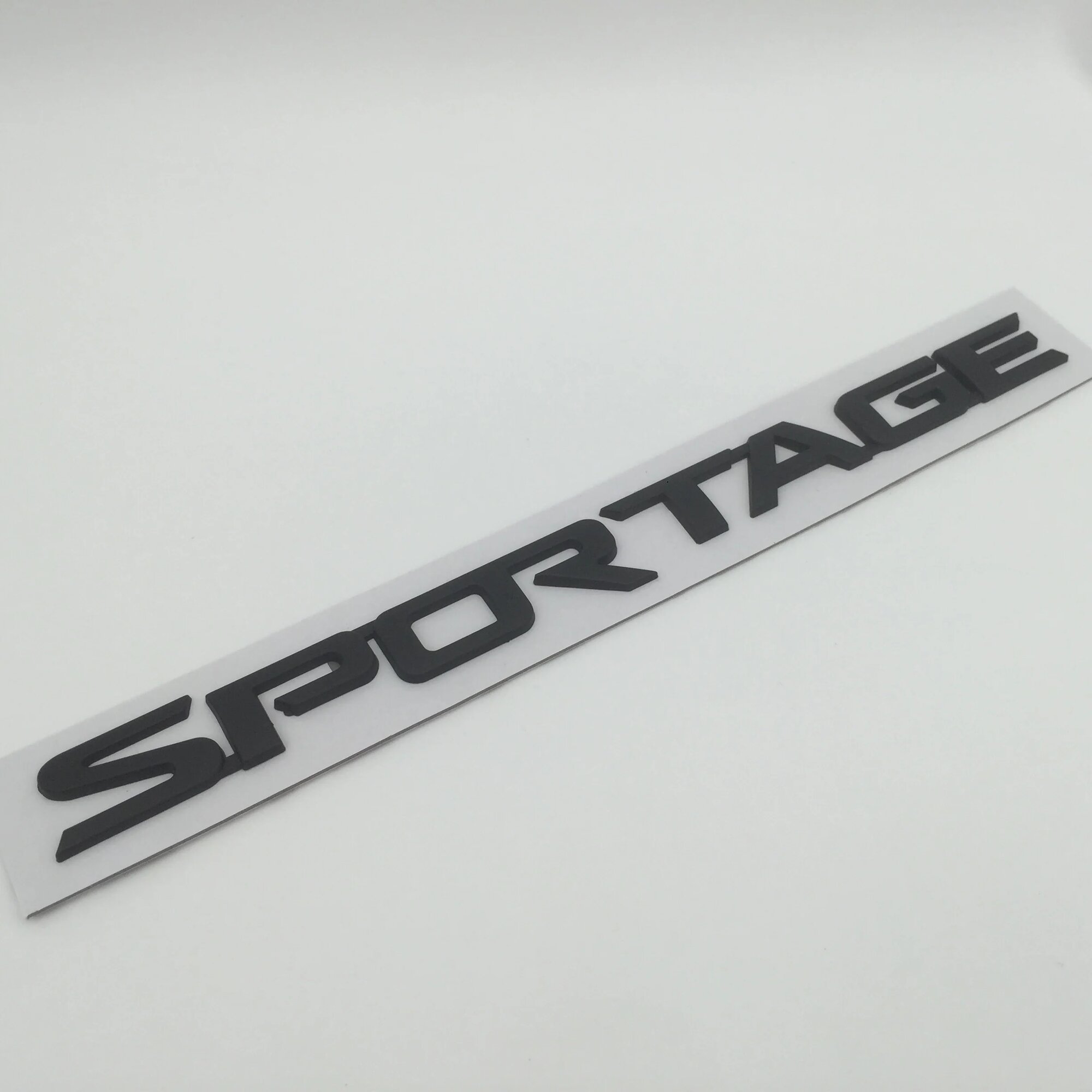 Наклейка Sportage, черная, ABS