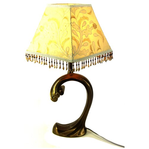Бронзовая настольная лампа на основании в форме волны в стиле модерн