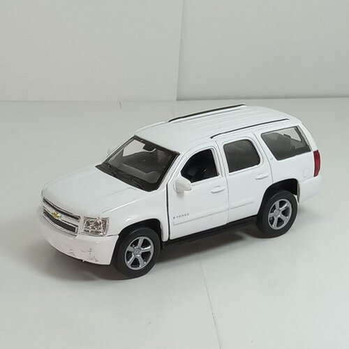 Металлическая машинка 1:34-1:39 CHEVROLET TAHOE 2008г, белый 43607D Welly металлическая машинка 1 34 1 39 chevrolet corvette 1982г желтый 43716d welly