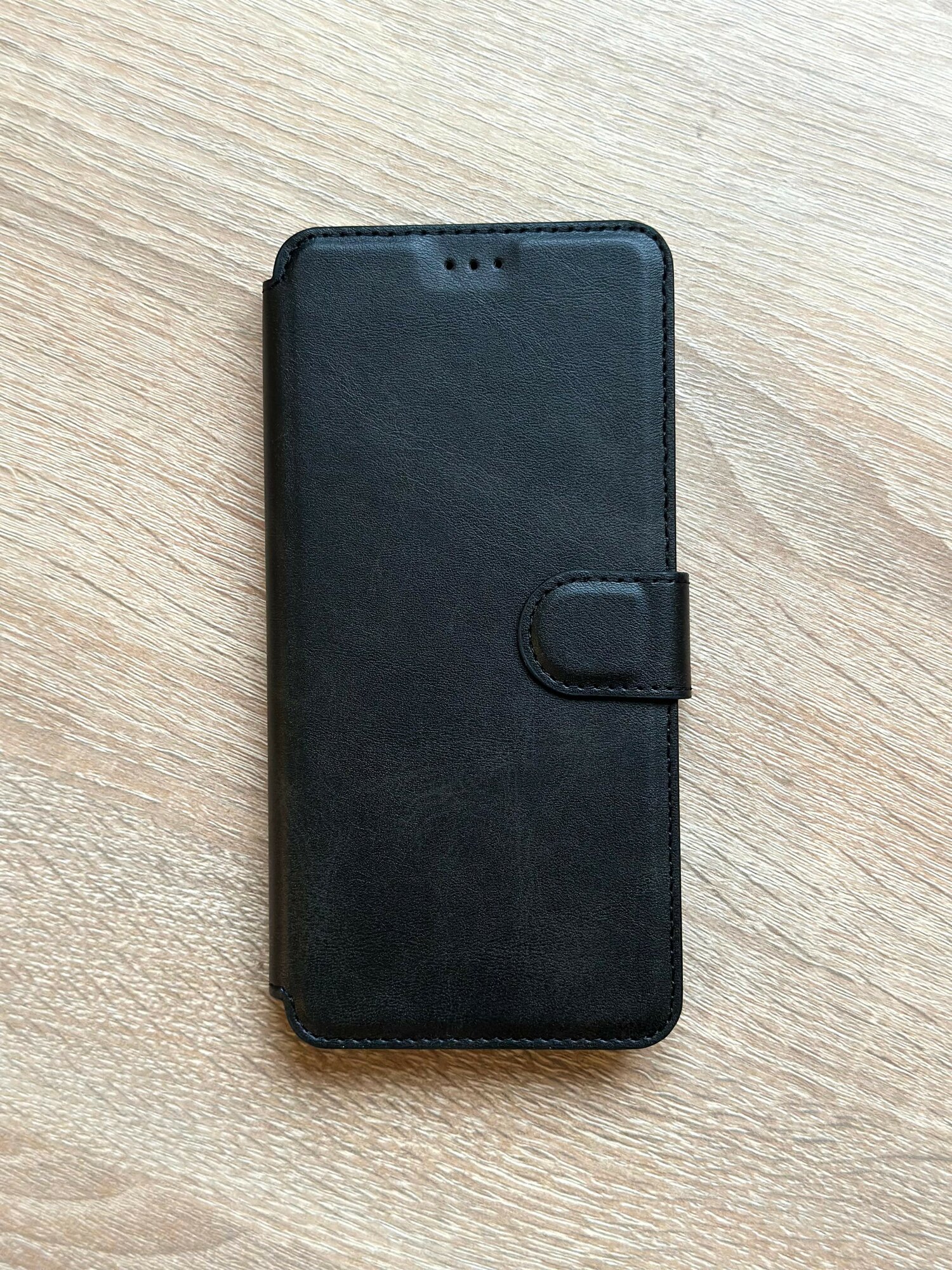 Чехол книжка для Samsung Galaxy A06 кожаный черный с магнитной застежкой — фото 1